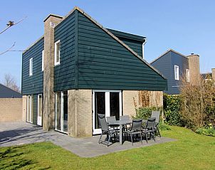 Vakantiehuis A 287 in De Cocksdorp, Texel met zonnig terras en groene tuin, ideaal voor een ontspannen verblijf op de Waddeneilanden.