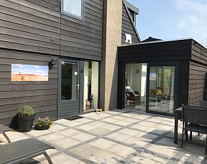 Gezellige buitenruimte van Vakantiehuis B 193 in De Cocksdorp, Texel, ideaal voor ontspanning op de Waddeneilanden.