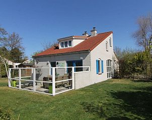 Vakantiehuis D 601 in De Cocksdorp, Texel met zonnig terras en groene tuin, ideaal voor een ontspannen verblijf op de Waddeneilanden.