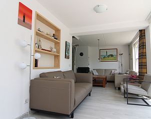 Gezellige woonkamer van Vakantiehuis G 769 in De Cocksdorp, Texel. Comfortabel interieur met veel natuurlijk licht en moderne inrichting.