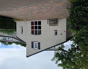 Vakantiehuis E 539, een charmant verblijf in De Cocksdorp, Texel, met uitnodigend terras en groene omgeving op de Waddeneilanden.