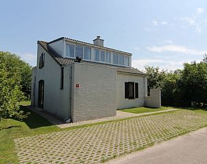 Vakantiehuis E 571 in De Cocksdorp, Texel, een charmant vakantiehuis omringd door groene natuur op de Waddeneilanden.