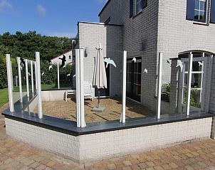 Geniet van het zonnige terras bij Vakantiehuis F 782 in De Cocksdorp, Texel. Perfecte plek om te ontspannen op de Waddeneilanden.