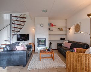Gezellige woonkamer in Annemein vakantiehuis, De Cocksdorp, Texel met comfortabele zithoek en moderne inrichting.