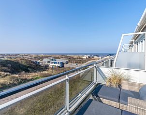 Balkon met uitzicht op zee bij Appartement Juliana 140 Eiland en Zeezicht, De Koog, Texel voor een adembenemend uitzicht.