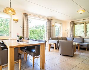 Dining room in Villa, De Koog, Texel with large table and lots of light for cozy meals.