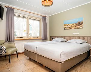 Comfortable bedroom in Villa, De Koog, Texel with double bed and restful furnishings.