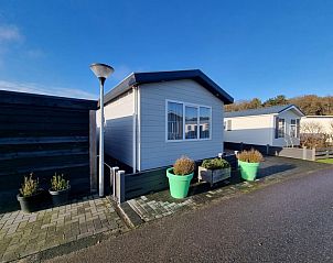 Chalet Bregkoog 103 on Chaletpark Bregkoog in De Koog, Texel with green planters.