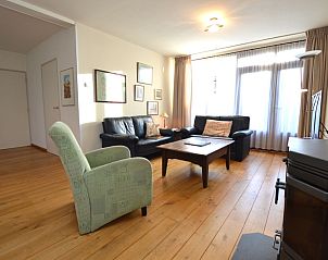 Stijlvolle zithoek in Orchismient 35, De Koog, Texel, perfect voor ontspanning.