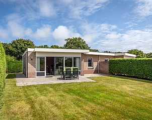 Vacation home Bungalow 31 in De Koog, Texel with sunny terrace and green surroundings.