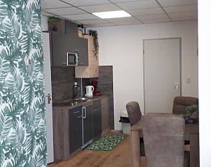 Gezellige keuken en eetruimte in Vakantiehuis Koogerduin, De Koog, Texel, met moderne inrichting.