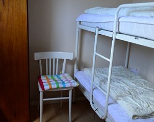 Comfortabele slaapkamer met stapelbed in Brink 20 vakantiehuis, De Koog Texel, ideaal voor gezinnen op de Waddeneilanden.