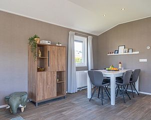 Interior of Chalet Bregkoog 262 in De Koog, Texel, with stylish dining area and modern furnishings.