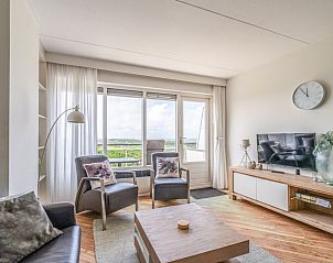 Helles Wohnzimmer im Apartment Juliana 146 Insel- und Meerblick, De Koog, Texel mit Panoramablick auf die Natur.