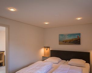 Attraktives Schlafzimmer im Ferienhaus Orchismient 55, De Koog auf Texel, Watteninseln.