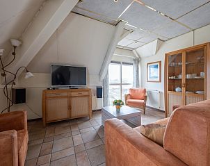 Gezellige woonkamer van Resort De Buteriggel - Appartement 0 in De Koog, Texel, met comfortabele zitplaatsen.
