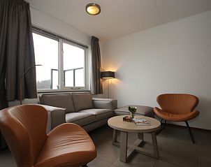 Cozy living room in Holiday Home, De Koog, Texel with comfortable seating area and modern furnishings for a relaxing stay.