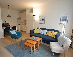 Open keuken en zithoek in Appartement Kerckeland 126, De Koog, Texel voor een ontspannen verblijf.