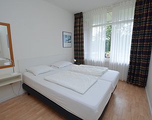 Comfortabele slaapkamer met tweepersoonsbed in Appartement Kerckeland 126, Texel.