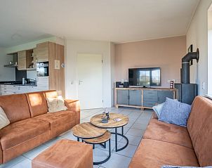 Ruime woonkamer met open keuken in Vakantiehuis in De Koog, Texel