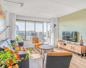 Gezellige woonkamer in Appartement Juliana 050 Eiland en Zeezicht, De Koog, Texel met uitzicht op de duinen.