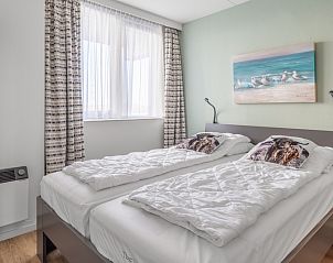 Comfortabele slaapkamer met tweepersoonsbed in Appartement Juliana 050 Eiland en Zeezicht, De Koog, Texel.