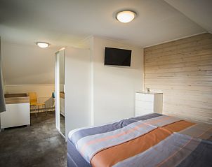 Gerumiges Schlafzimmer in Stappeland - IJsvogel Ferienhaus De Koog Texel mit Sitzecke.