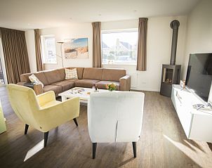 Gemtliches Wohnzimmer im Stappeland - IJsvogel Ferienhaus De Koog Texel mit Sitzecke.
