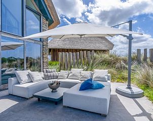 Sitzecke auf der Terrasse des Ferienhauses in De Koog, ideal fr Entspannung auf Texel.