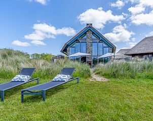 Ferienhaus in De Koog mit Liegesthlen im Garten, ideal zum Sonnenbaden auf Texel, Wadden Islands.