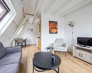 Dining area in Two persons apartment large - second floor, De Koog, Texel, with comfortable chairs.