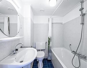 Stylish bathroom in Two persons apartment large - second floor, De Koog, Texel, with bath and shower.