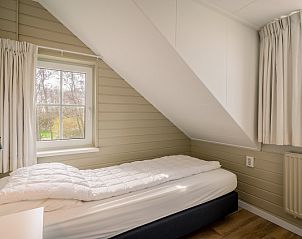 Knusse eenpersoonskamer in De Zandhaas, vakantiehuis op Texel, ideaal voor een rustig verblijf op de Waddeneilanden.