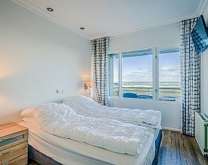 Ruime slaapkamer met zeezicht in Appartement Juliana 164 Zeezicht, De Koog, Texel.