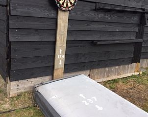 Tafelvoetbalspel bij Huize 100-1, vakantiehuis in De Koog, Texel, voor plezier en competitie.