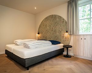 Comfortabele slaapkamer in Villa 25a, De Koog, Texel met rustgevende inrichting op de Waddeneilanden.