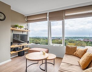 Wohnzimmer mit Panoramablick in Appartement Juliana 178 Eilandzicht, De Koog, Texel. Komfortable Ferienwohnung auf den Watteninseln.