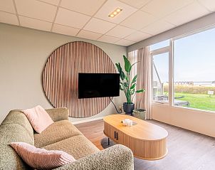 Einladende Sitzecke im Appartement Juliana 028 Zeezicht, De Koog, Texel mit Meerblick.