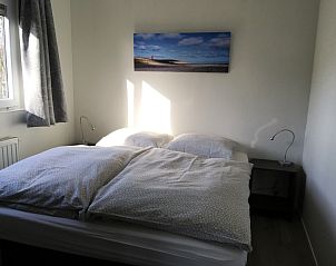 Gemtliches Schlafzimmer im Chalet Elsrijk, De Koog, Texel. Genieen Sie Komfort und Ruhe auf den Watteninseln in diesem charmanten Ferienhaus.