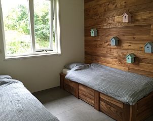 Kinderzimmer im Ferienhaus De Koerie, De Koog, Texel, mit Holzdetails und Aussicht.