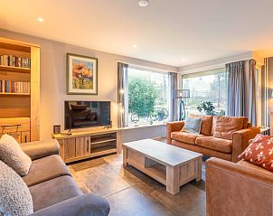 Gezellige woonkamer in Huis ter Duin, vakantiehuis in De Koog, Texel met ruime zithoek.