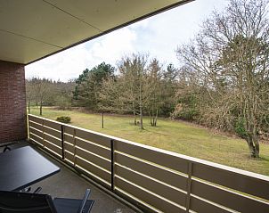 Balkon van 't Kerckeland - Appartement Kerckeland 88, De Koog, Texel, met prachtig uitzicht op de omliggende natuur.