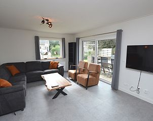 Gemtliches Wohnzimmer des Ferienhauses Stappeland 203 in De Koog, Texel mit bequemer Sitzecke.