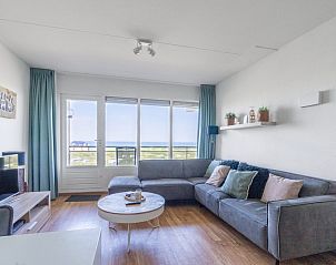 Moderne lounge met uitzicht op de kust in Appartement Juliana 102 Zeezicht, De Koog, Texel.