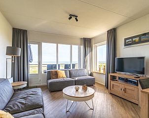 Gezellige woonkamer in Appartement Juliana 118 Zeezicht, De Koog, Texel met panoramisch uitzicht op zee.