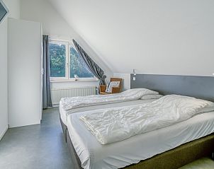 Gezellige slaapkamer in Vakantiehuis Kamperfoelie 93, De Koog, Texel, perfect voor een ontspannen nachtrust op de Waddeneilanden.