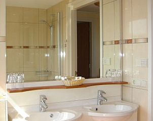 Luxury bathroom with double sink in 6-pers. Vacation home with Sauna in De Koog, Texel, Wadden Islands.