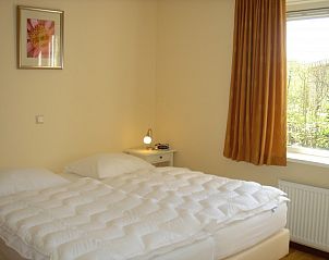 Bedroom with double bed in 6-pers. Vacation home with Sauna in De Koog, Texel, Wadden Islands.