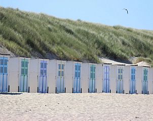 Colorful beach houses on Texel, near 6-pers. Vacation home with Sauna in De Koog, Wadden Islands.