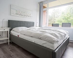 Comfortabele slaapkamer in 't Kerckeland - Appartement Kerckeland 92 in De Koog, Texel met uitzicht op de natuur.